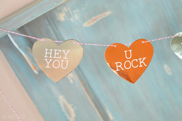 This Foiled Conversation Heart Banner is the perfect addition to any Valentine's Day decor. It doesn't take long to create either.