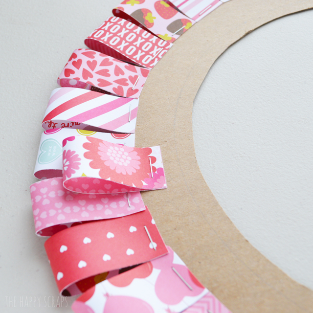 Creating this Be Mine Valentine Wreath is simple and will be a fun piece to add to your Valentine's day decor. Get the tutorial at The Happy Scraps. 