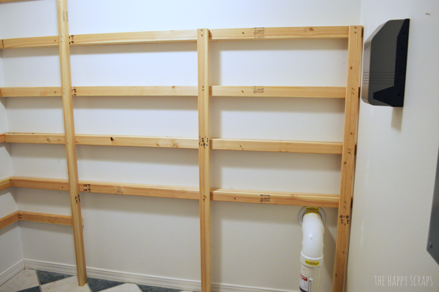 Creative DIY Functional Pantry Shelving with this tutorial from The Happy Scraps. Learn how to use cheaper wood and still get a nice looking pantry.