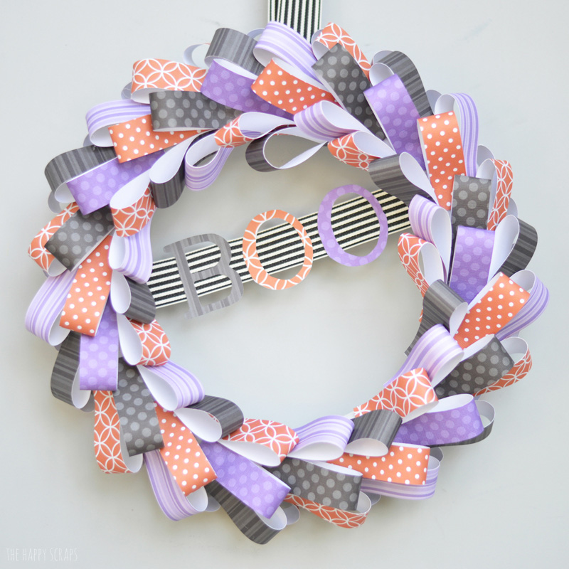 Make this fun BOO Halloween Wreath to hang on your front door. It's made from paper, and so simple to make!