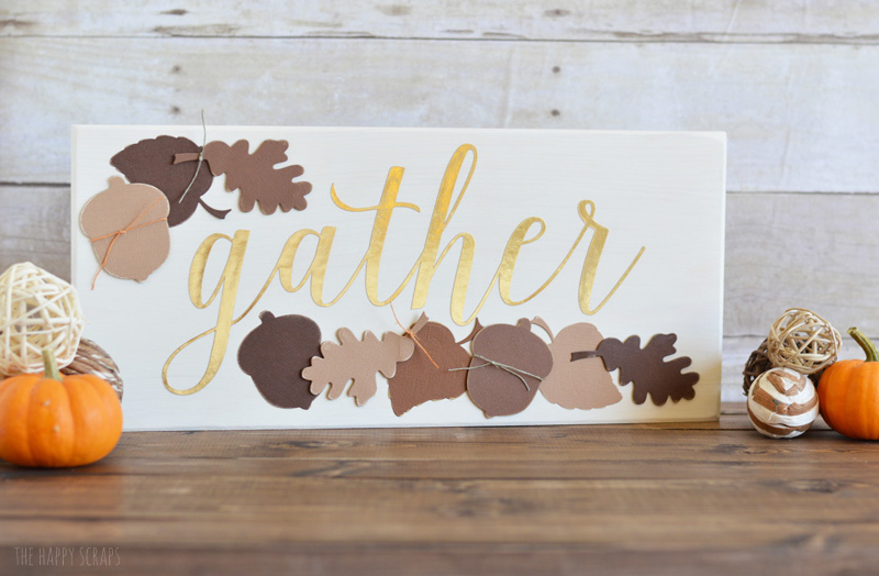 Make this beautiful DIY Gather Thanksgiving Sign to have on display for your Thanksgiving holiday. The colors, leaves & acorns are perfect for Thanksgiving.