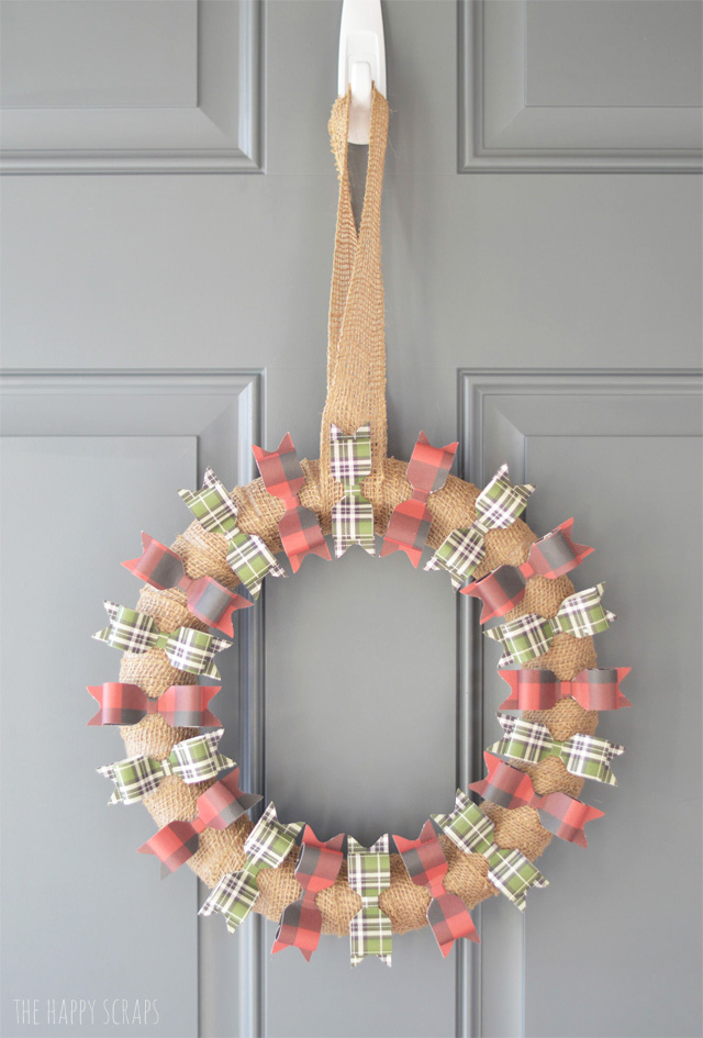 Adorn your front door with this simple + cute Paper Bow Christmas Wreath this holiday season. I'm sharing the simple tutorial on the blog. 
