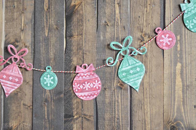 Create this simple Paper Christmas Garland with cardstock, baker's twine and your Cuttlebug. It's easy to do, I show you how on the blog. 