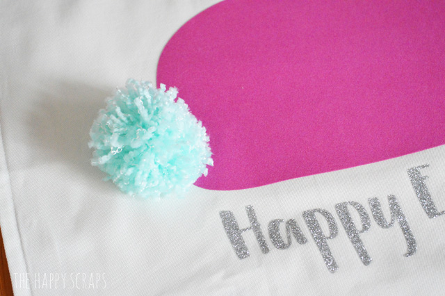 Every bunny needs a fluffy tail. Stop by the blog to learn how to make this Pom Pom Tail Bunny Rabbit Easter Pillow. It's quick + easy! 