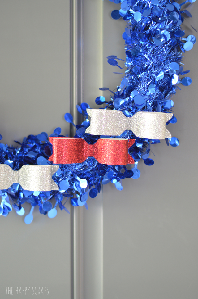 Everyone needs some Red, White & Blue to decorate for the 4th of July, and this sparkly Patriotic Wreath is perfect! Stop by the blog to get the tutorial!