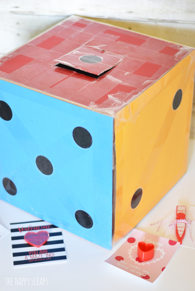 Creating a Giant Dice Valentine Box is simple and it's a fun box for the kids to take to school. All you need is a few basic supplies for this project. 