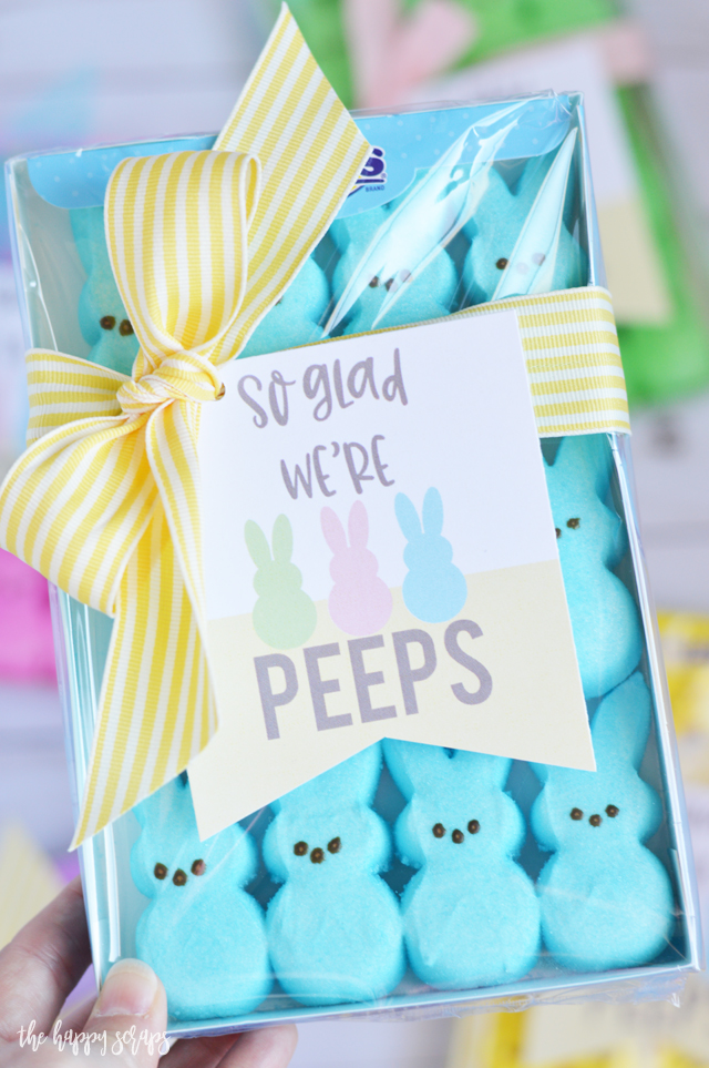 This So Glad We're Peeps Easter Gift is so quick + simple to put together. Grab the printable tag from The Happy Scraps, cut them out, and tie them onto a package of peeps with a cute ribbon. 