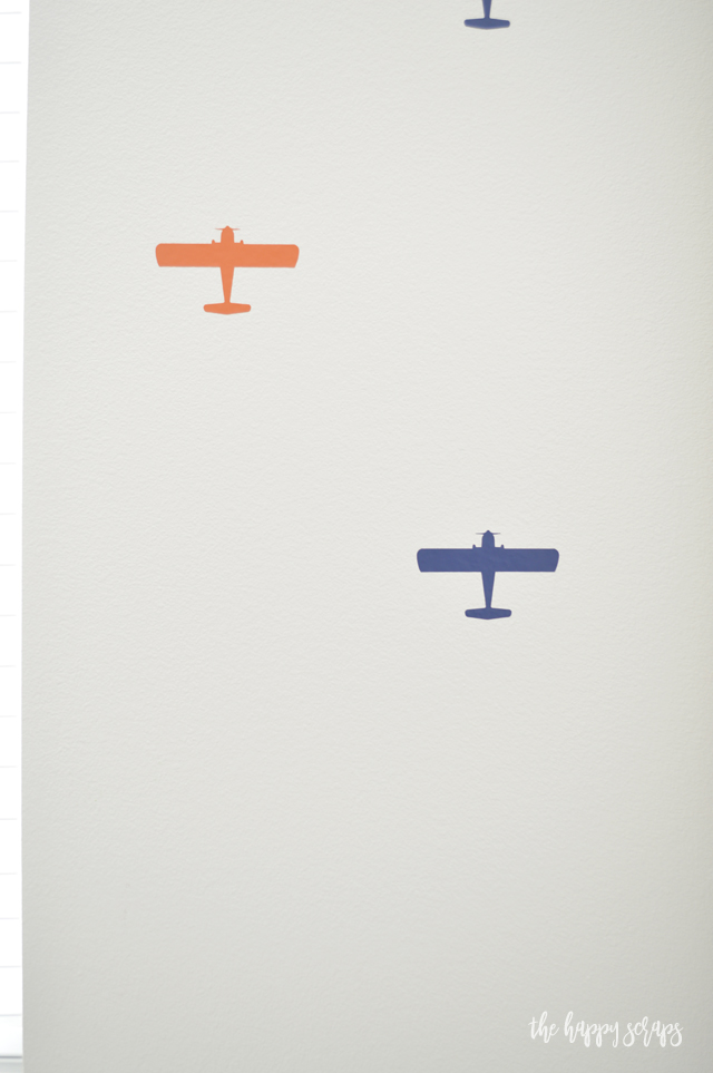 Putting this Airplane Accent Wall together is easier than you think! Using vinyl from Expressions Vinyl and my Cricut to cut them out + it was a breeze to put them on the wall.