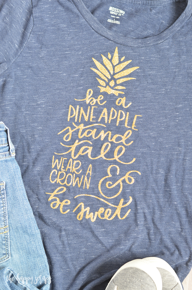 Everyone needs one of these Be A Pineapple Glitter Tee shirts. The glitter makes it so fun and sparkly + there is no mess when using glitter iron-on! Get the details for this from The Happy Scraps. 