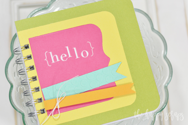 This Hello Mini Notebook is the perfect project for an afternoon craft session. No patterned paper needed, just some good quality cardstock. 
