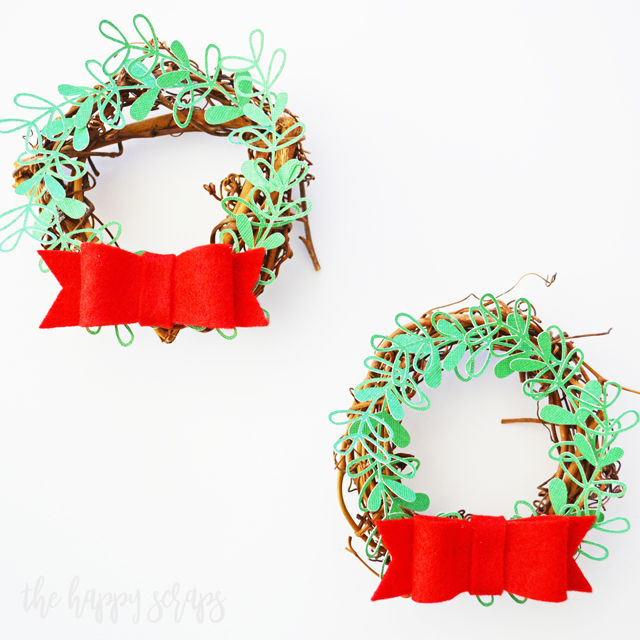 Creating these DIY Mini Christmas Wreaths for Kitchen Cabinets is a fun + simple project to add a pop of holiday to your kitchen. Tutorial on the blog.
