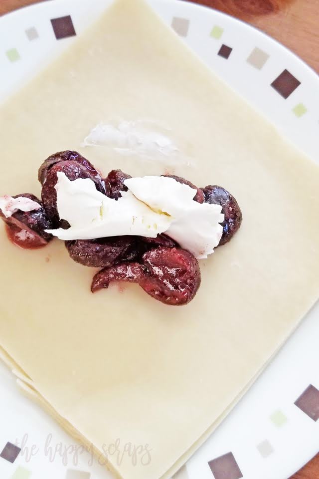This Cherry Egg Roll Dessert is the perfect combination of cherries, cream cheese, cinnamon + sugar, and sweetened condensed milk. You'll want to make this! 