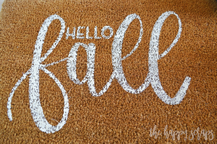 Having a DIY Hello Fall Front Porch Rug is the perfect way to welcome the fall weather! Get the details for creating your own on the blog.